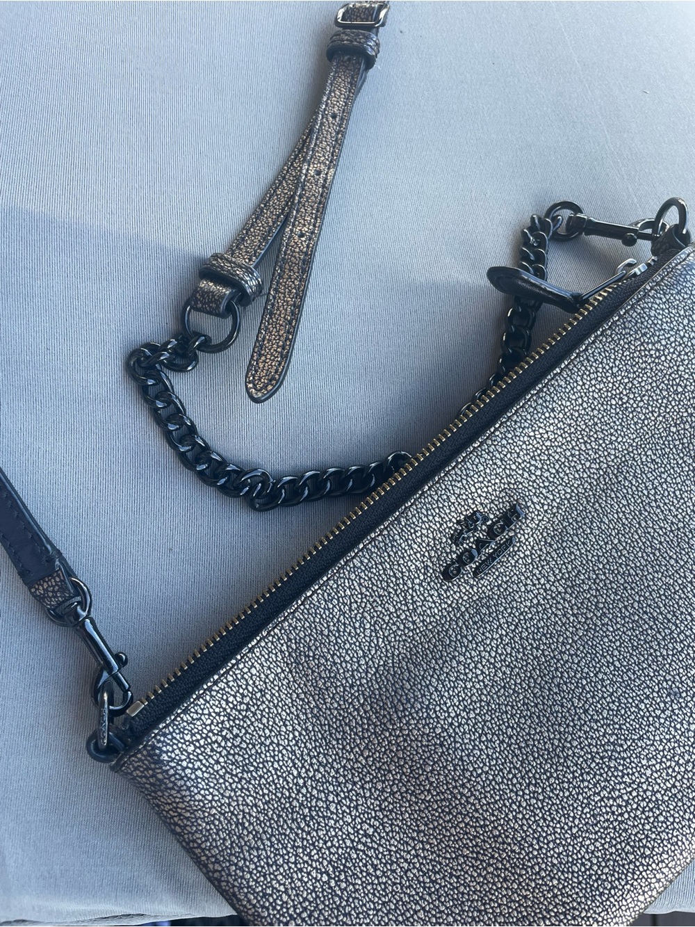 Coach Metallic Pebbled Leather
Crossbody Clutch Bag Muted
Gold Gunmetal Gray